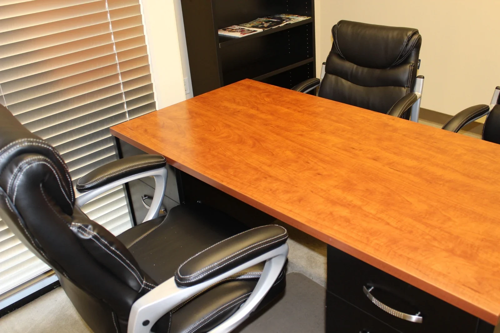 Guest seating beside the wood-top desk in the Day Office.
